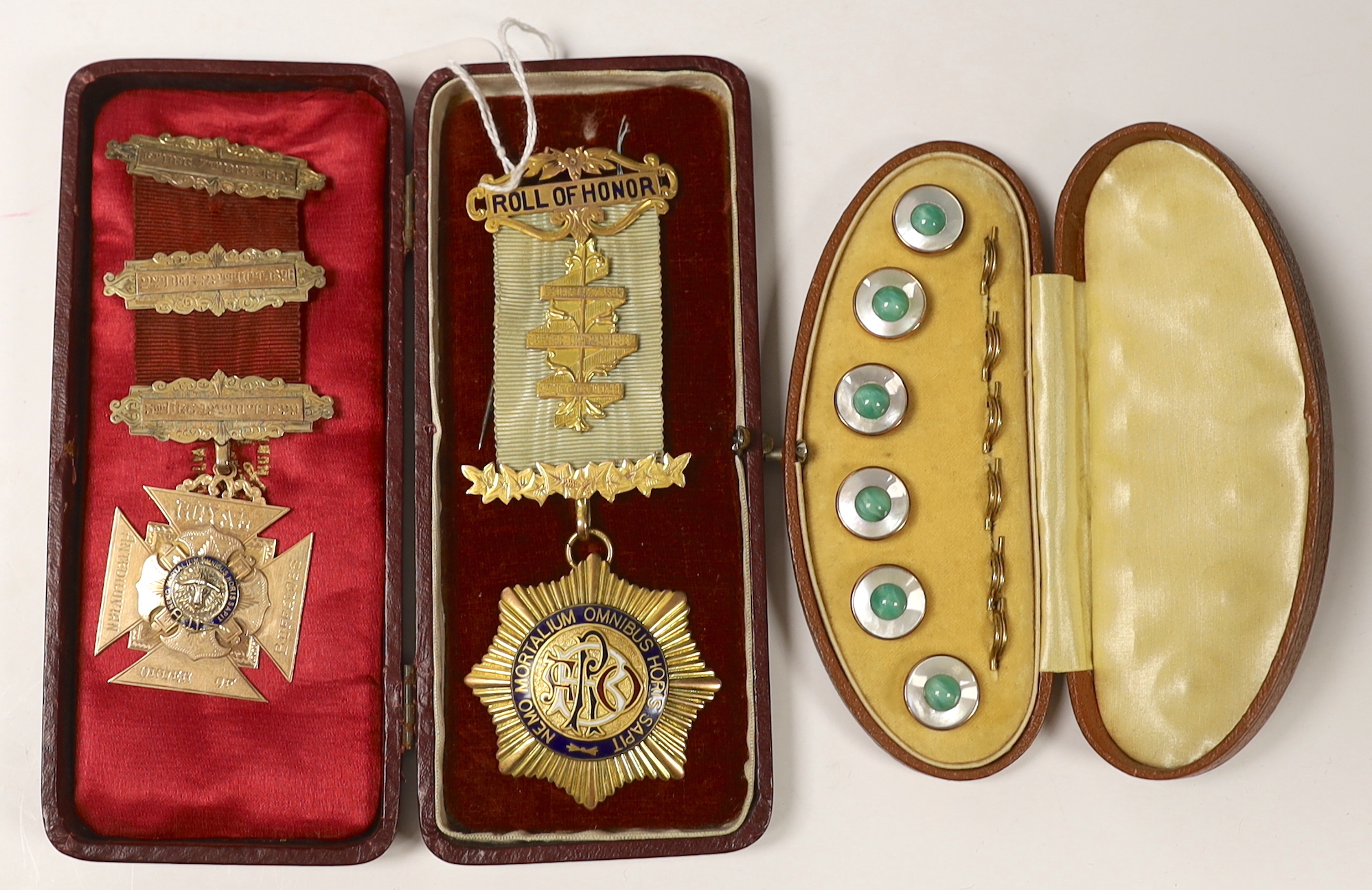 A late Victorian 9ct and enamel masonic jewel and a later Edwardian 9ct gold and enamel masonic jewel, gross weight 46.5 grams, together with a cased gilt metal and paste dress stud set